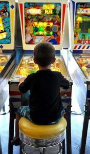 Silverball Arcade Boy Playing Pinball